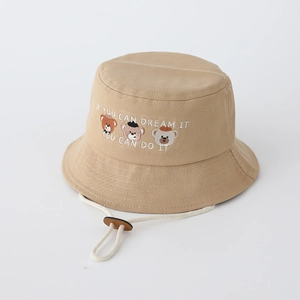 Close-up of three bear embroidery and motivational quotes on kids' sun hat
