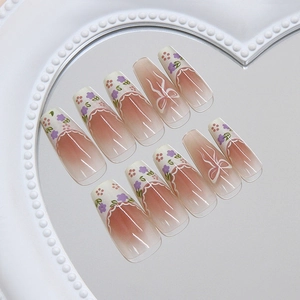 French bow floral press-on nails with cream lace and gradient pink flower design