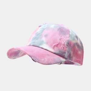 Detailed view of the tie-dye pattern and distressed ripped holes on the baseball cap