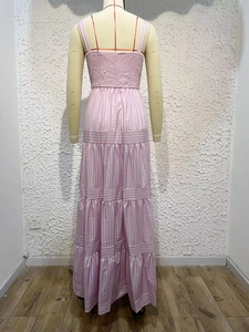 Detail of pink and white striped tiered dress showing the back elastic smocked design