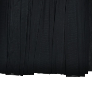 Detailed macro view of black mesh fabric showing fine mesh texture and elegant draping effect