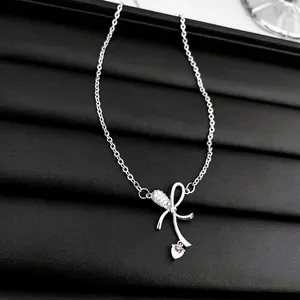 Pink heart and bow necklace in silver finish with sparkling cubic zirconia crystals
