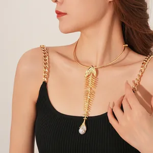 Luxury gold fishbone choker necklace with sparkling crystals and a white pearl drop