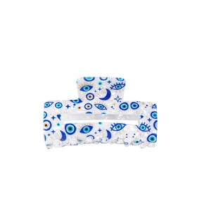 Rectangular celestial eye hair claw with blue evil eye, crescent moon and star patterns
