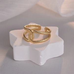 Golden double-layered open ring with twisted rope texture on a star base