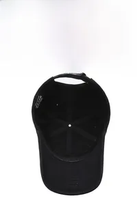 Detail of 100% cotton interior with adjustable strap and stitching on black baseball cap
