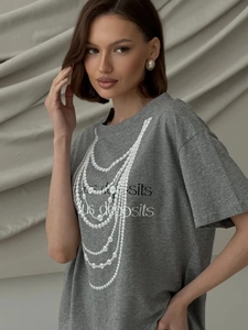 Close-up of the elegant multilayer pearl necklace print on a gray cotton t-shirt