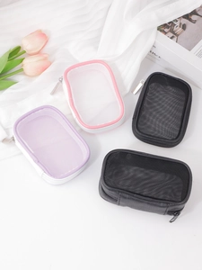 Detail view of mesh makeup pouches in pink and purple with durable metal zippers