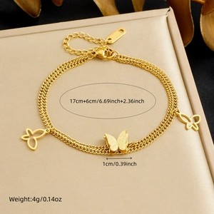 Close-up of 18K gold-plated double-layer bracelet with 3D matte butterfly charms