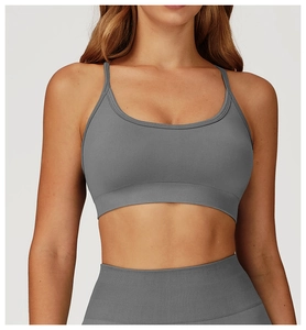 Close-up of dark grey seamless sports bra with fine ribbing and elastic straps