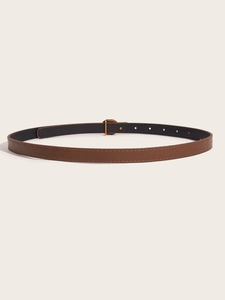 Close-up of brown leather belt featuring a golden metal buckle and adjustable pin holes