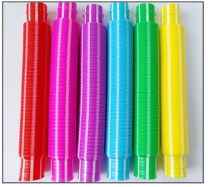 Close-up of colorful corrugated stretch tubes in six vibrant colors for sensory play