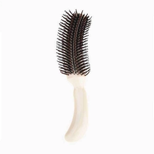 Ergonomic S-shaped hair styling comb with white curved handle and dark bristles for volume
