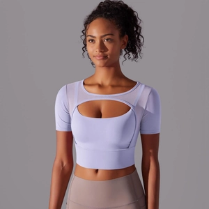 Detail of light purple yoga top featuring mesh stitching and hollow-out design