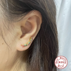 Macro view of S925 sterling silver ear crawler with colorful gradient gemstones
