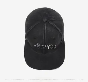 Detailed top view of a black baseball cap with white Scenario planning embroidery