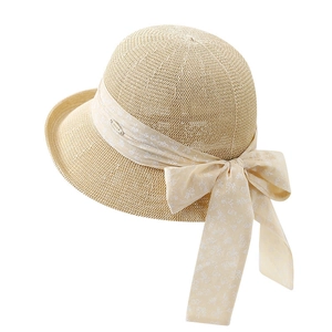Elegant Hepburn style beige knit sun hat with floral ribbon bow for summer travel