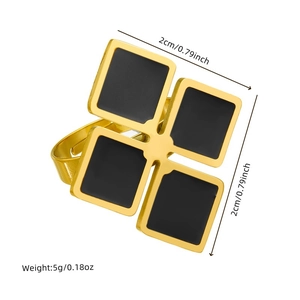 Detail showing golden four-leaf clover ring with black square inlays and measurements