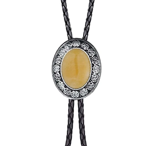 Close-up of yellow agate gemstone bolo tie with vintage silver floral metal carving