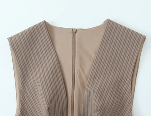 Detail of V-neck stripe dress with concealed back zipper and smooth brown lining