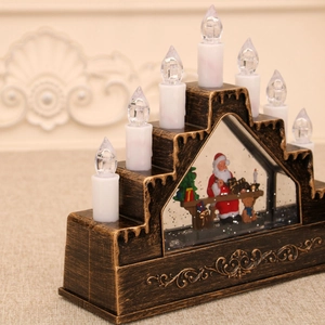 Detail of 7-head LED Christmas candle holder with vintage base and Santa landscape