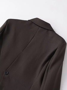 Detail of the structured collar and back seam of this dark brown tailored blazer