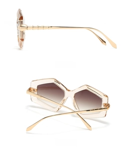 Detail of champagne gold square sunglasses with bamboo-style gold metal temples