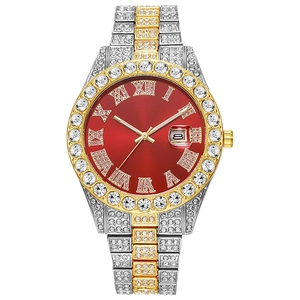 Close-up of luxury hip-hop watch featuring red dial, Roman numerals, and diamond-set bezel