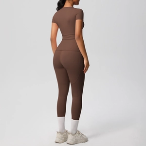 Detail view of brown compression yoga set showing slim fit short sleeve and high waist pants