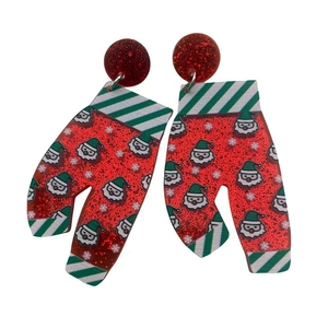 Close-up of Christmas glove acrylic earrings with red glitter and Santa Claus motifs