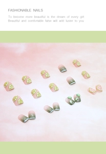 Macro shot of 3D lemon press-on nails featuring green gradient and citrus slice patterns