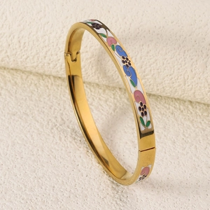 Detailed side view of 18K gold-plated bangle featuring colorful enamel floral patterns