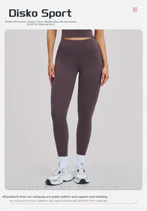 Detail view of high-waisted dark purple yoga leggings with seamless moisture-wicking fabric