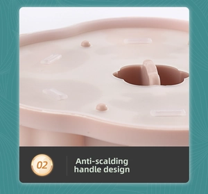 Detail of baby food silicone mold lid featuring an anti-scald ergonomic handle design