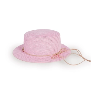 Detail of pink straw sun hat featuring a fine woven texture and brown bow decoration