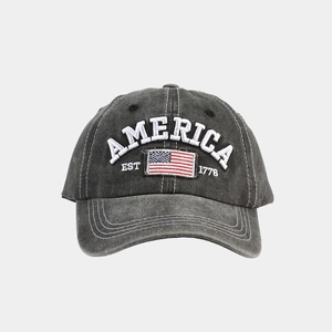Close-up of vintage washed cotton baseball cap with American flag and 1776 embroidery