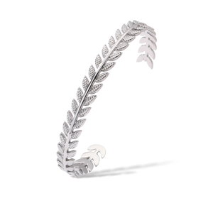Detailed macro view of silver leaf-shaped textured relief on stainless steel cuff bracelet