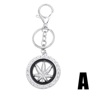 Silver maple leaf keychain with sparkling rhinestones and lobster clasp on white background