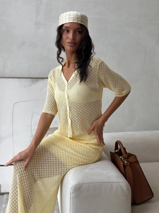 Detailed knit pattern of light yellow crochet cardigan and matching hollow skirt set
