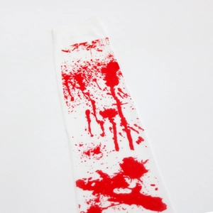 Detail of white Halloween thigh-high stockings with realistic red bloody handprints