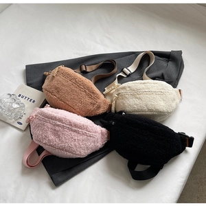 Detailed view of plush waist bags in brown white pink and black with adjustable straps