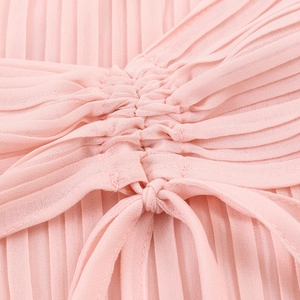Pink chiffon pleated dress with elegant knot detail and lightweight bell sleeves