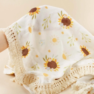 Cotton sunflower baby blanket with elegant tassel edges for stroller or bath use