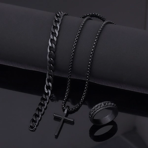 Polished black stainless steel set featuring cross pendant necklace, bracelet, and textured ring
