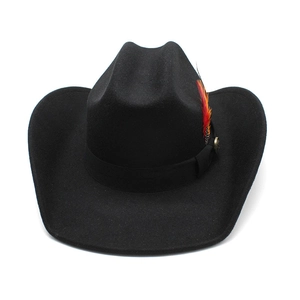 Detail of a black wool cowboy hat featuring a colorful feather and a buckled band