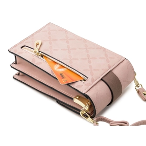 Pink minimalist crossbody phone bag with detachable strap and golden zipper hardware