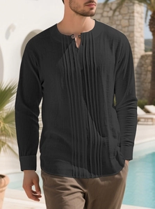 Detail of black cotton linen shirt featuring pleated front and small stand collar