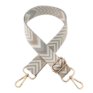 Adjustable woven wide shoulder strap with chevron pattern and gold metal buckles