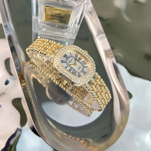 Elegant gold oval quartz watch for women with rhinestone inlay and Roman numerals