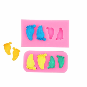 3D baby feet silicone mold for fondant chocolate and clay crafting on white background